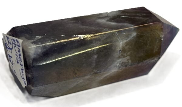 Standing rainbow amethyst aura polished crystal point 12 sians emporium Polished rainbow amethyst aura quartz generator point showing iridescent green violet and gold metallic sheen over natural chevron banding